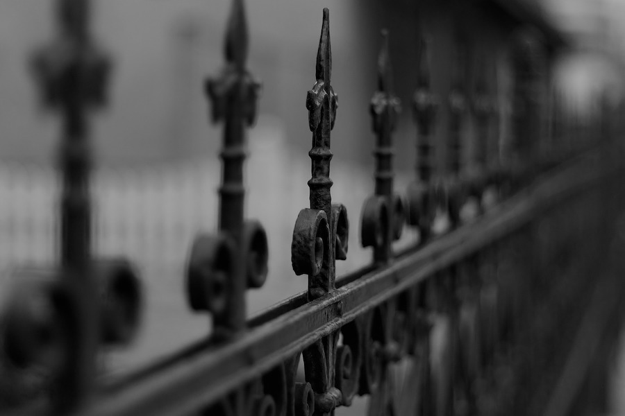 black and white image of fence