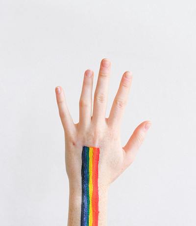 hand with rainbow painted on